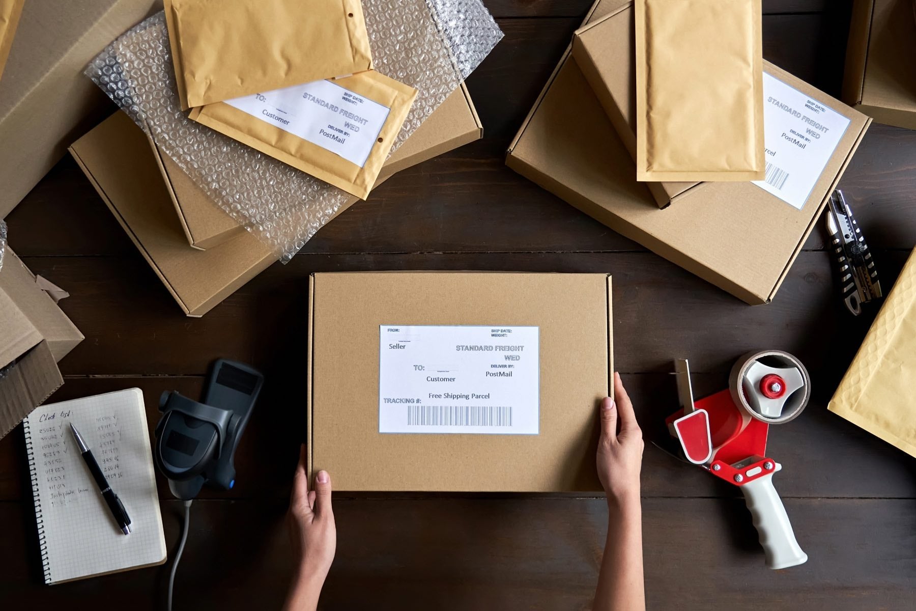 Shipping boxes and shipping envelopes, bubble wrap, set up on a table