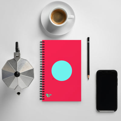 Circling around pink spiral notebook