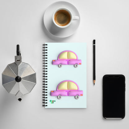 Pink car in blue spiral notebook